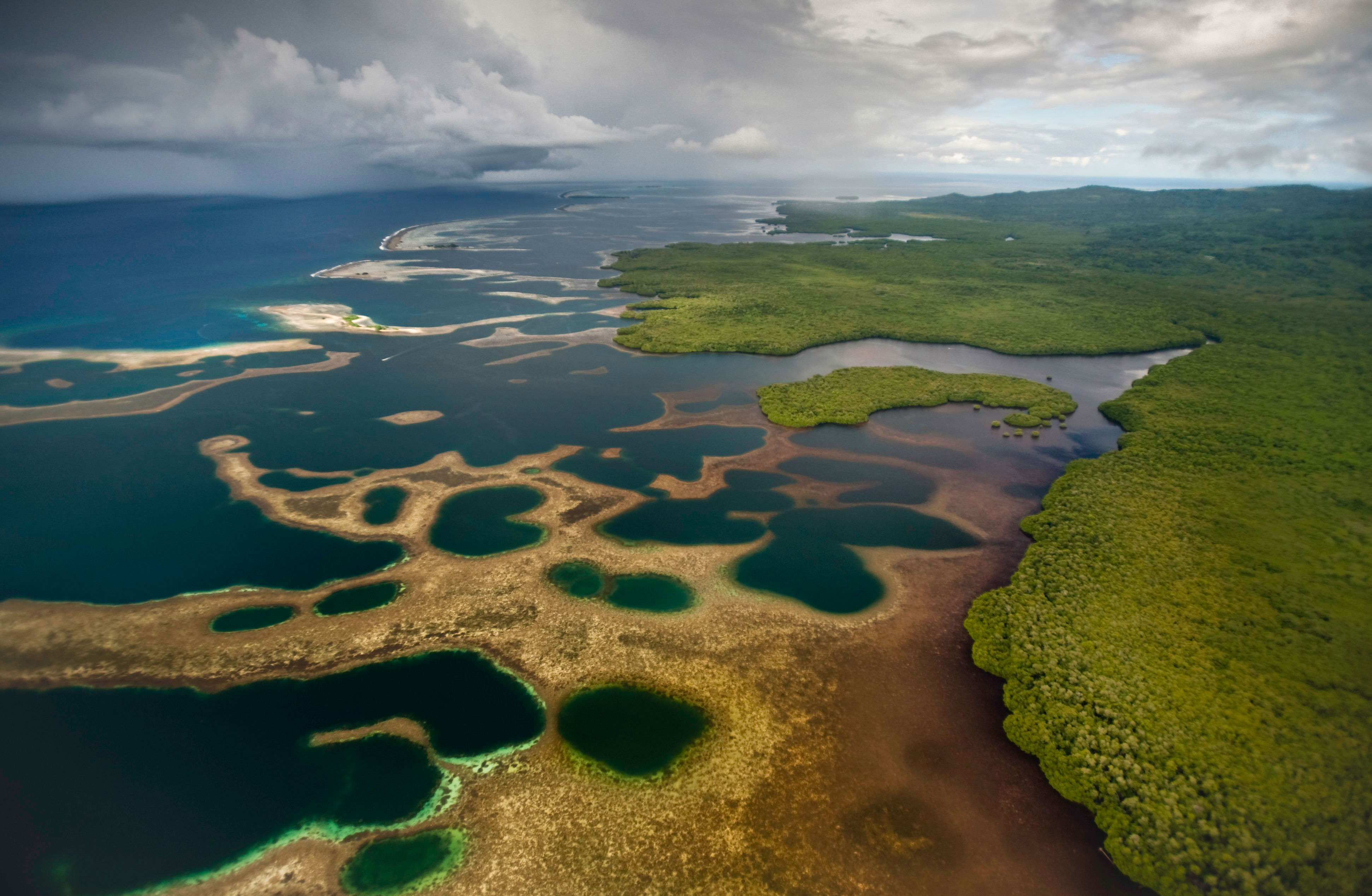 Aerial view of the Nahtik Marine Protected Area adjacent to the Enipein Mangrove Forest Reserve, Pohnpei, Micronesia.